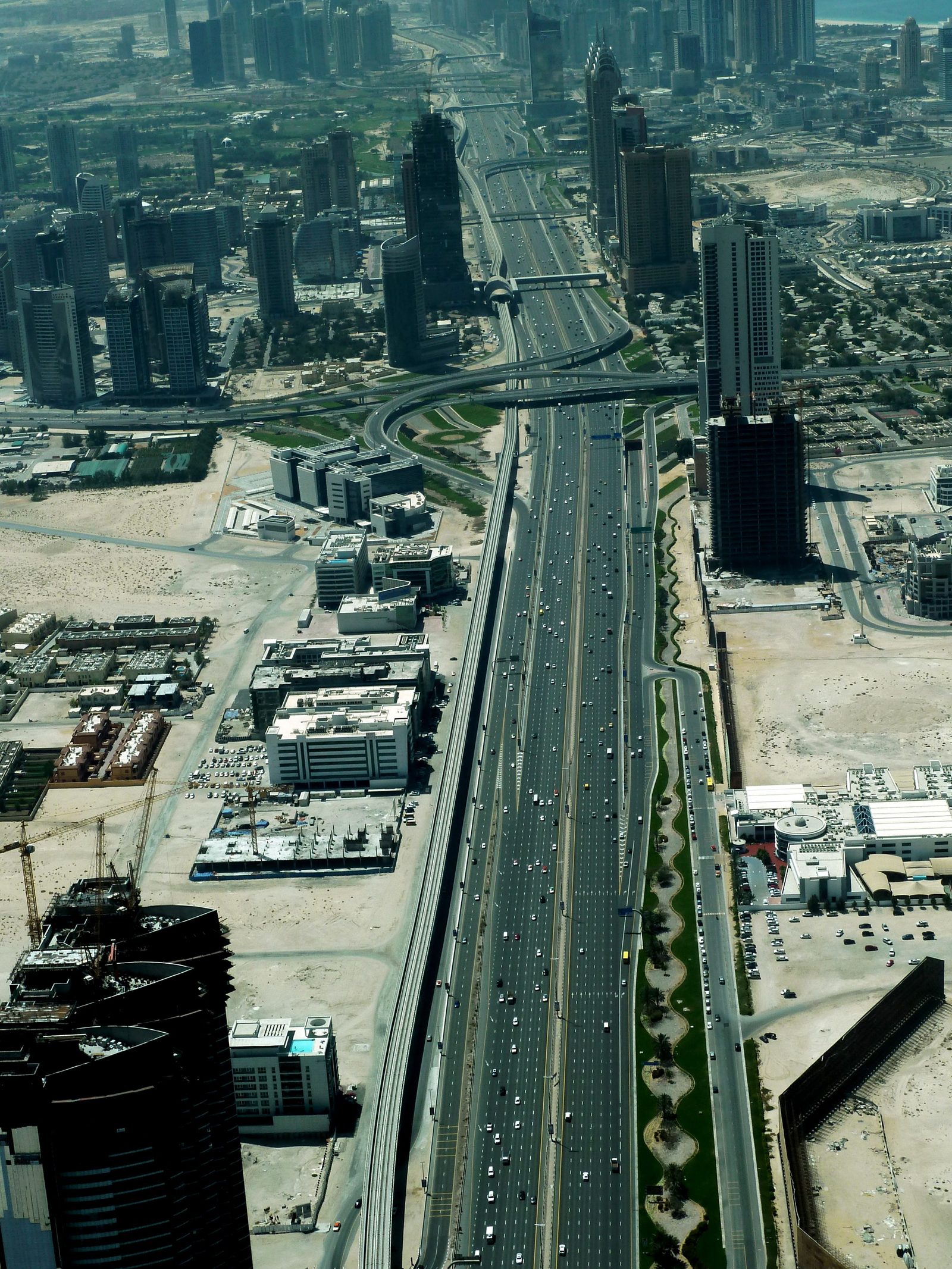 Dubai Marina towers, rooftops and Sheikh Zayed Road seen from above.